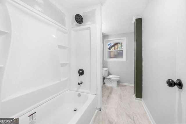 bathroom with shower / tub combination and toilet