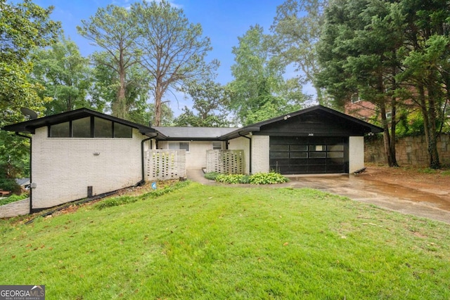 ranch-style home with a front yard and a garage