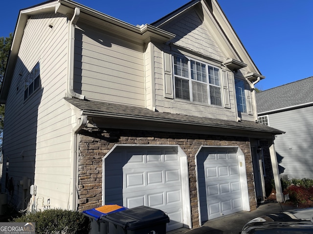 view of property exterior featuring a garage