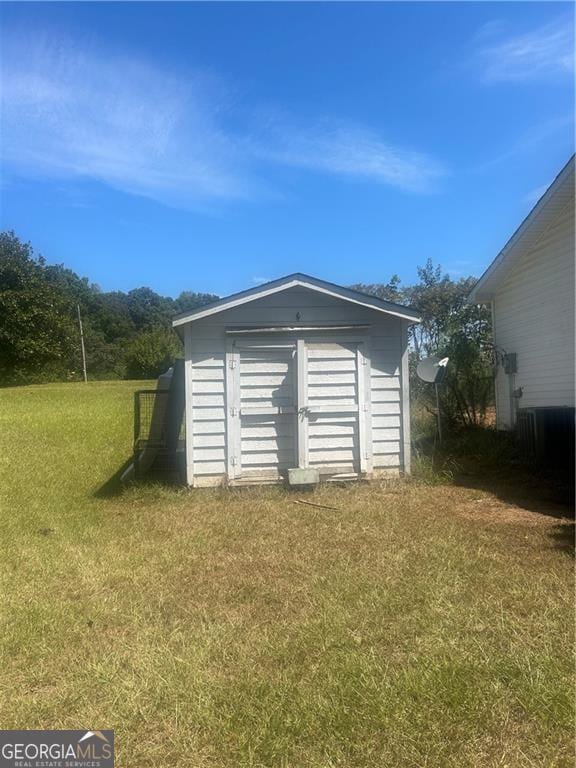 garage with a lawn