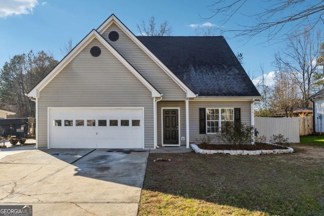 view of front of home with a garage and a front lawn