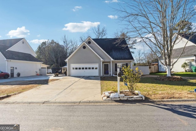 view of front property with a front lawn and a garage