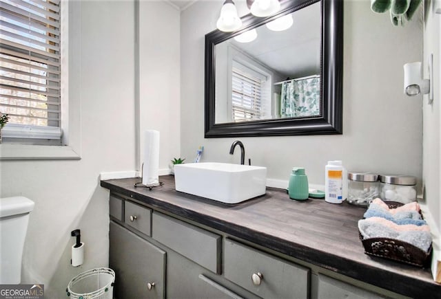 bathroom featuring vanity and toilet