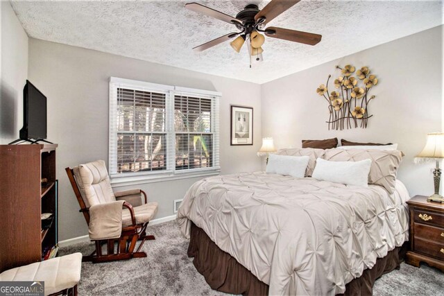 sitting room with wooden walls and ceiling fan