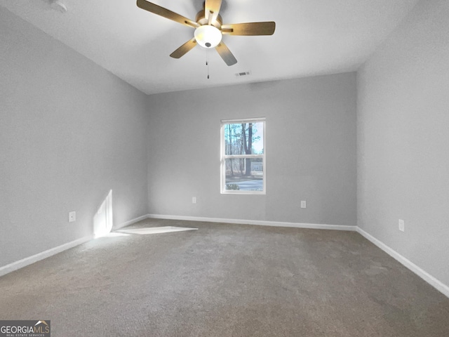 spare room featuring carpet flooring and ceiling fan