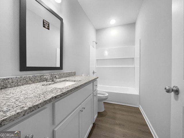 full bathroom with shower / tub combination, hardwood / wood-style floors, vanity, and toilet