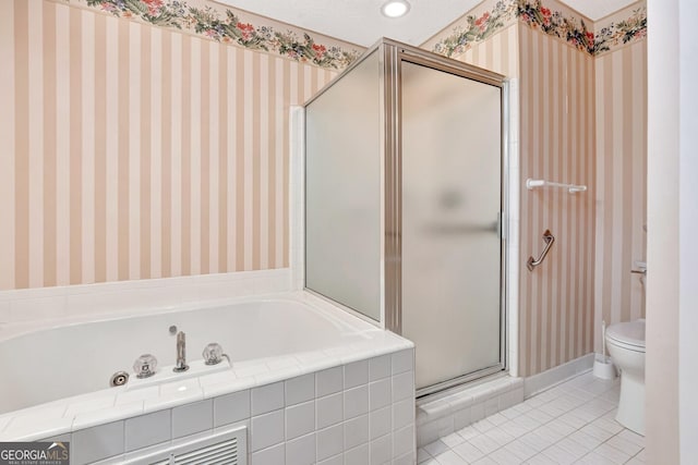 bathroom featuring toilet, tile patterned flooring, a textured ceiling, and plus walk in shower