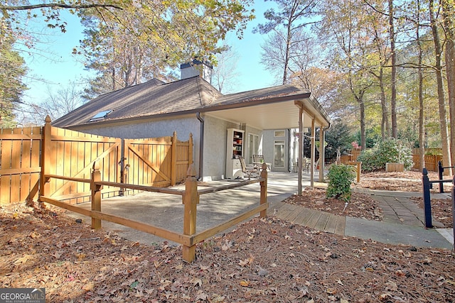 back of property featuring a patio area