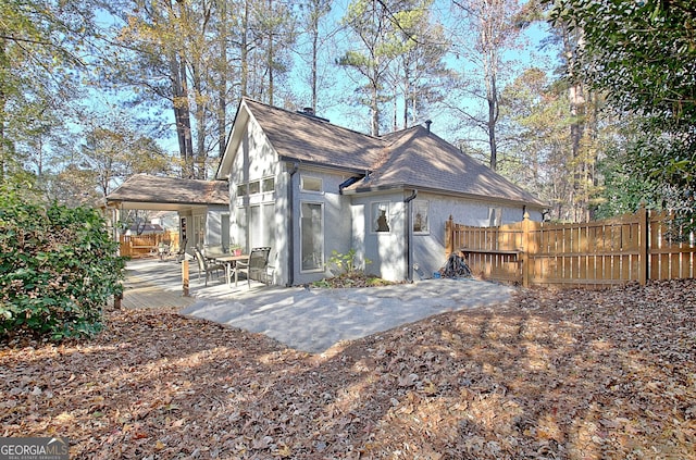 view of side of home with a patio