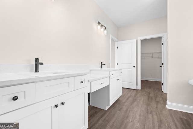 bathroom with wood-type flooring and vanity