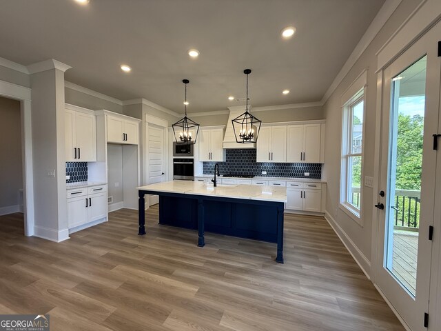 5613 Meadow View Dr, Jefferson, GA 30549 - kitchen featuring decorative backsplash, white cabinets, ornamental molding, and wall oven