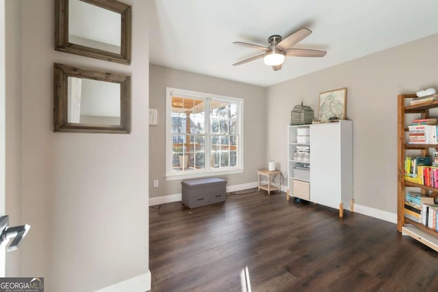 miscellaneous room featuring ceiling fan and dark hardwood / wood-style floors