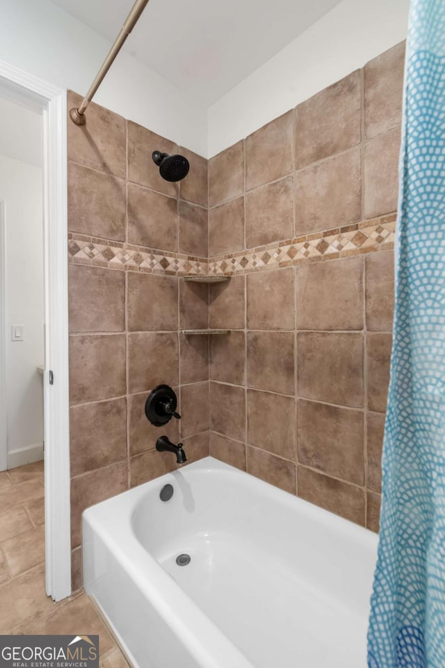 bathroom with shower / bath combination with curtain