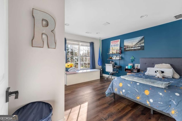 bedroom with wood-type flooring