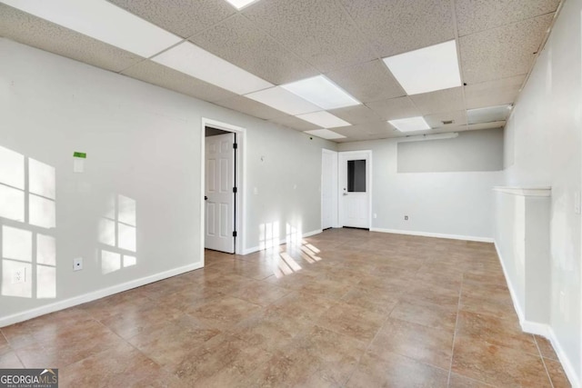 spare room featuring a paneled ceiling