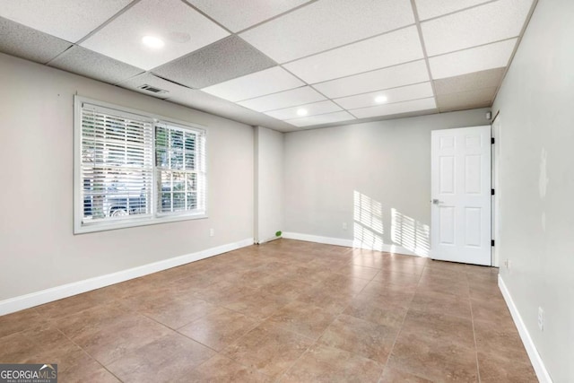 spare room with a drop ceiling