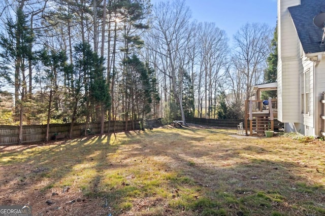 view of yard with a wooden deck