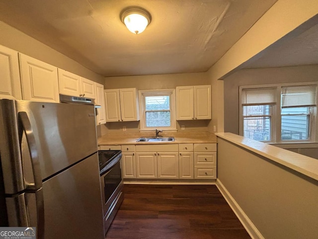 kitchen featuring white cabinetry, appliances with stainless steel finishes, sink, and dark hardwood / wood-style flooring