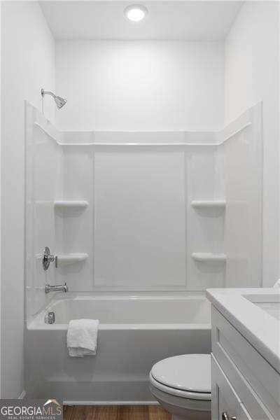 full bathroom with vanity, toilet, and bathtub / shower combination