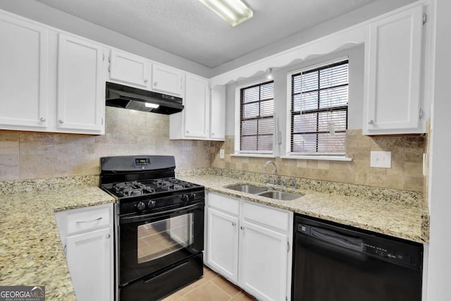 kitchen featuring black appliances, white cabinets, light tile patterned floors, and sink