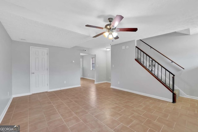 unfurnished living room featuring ceiling fan