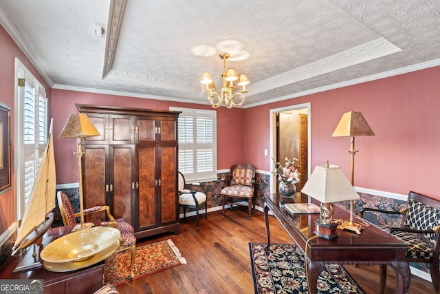 home office featuring hardwood / wood-style flooring, a notable chandelier, a raised ceiling, crown molding, and a textured ceiling