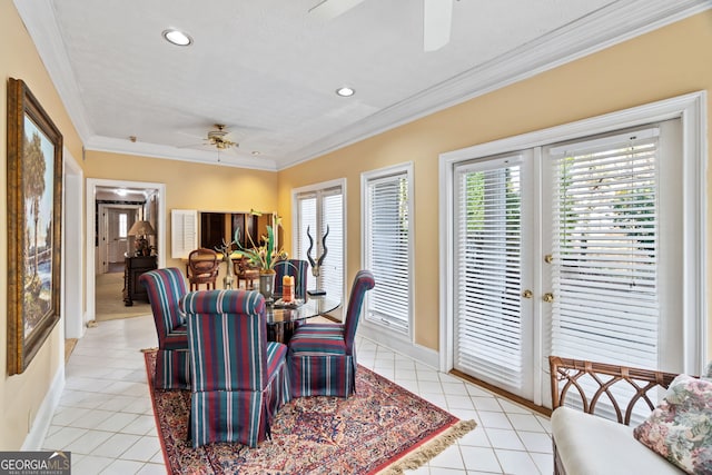 dining space featuring light tile patterned flooring, ornamental molding, ceiling fan, and french doors