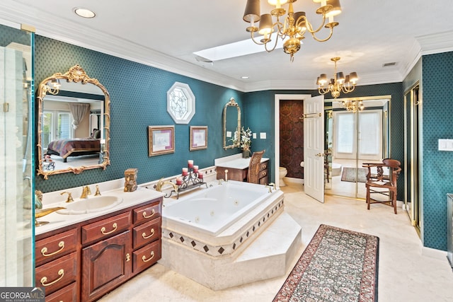 bathroom featuring crown molding, toilet, a chandelier, and a wealth of natural light