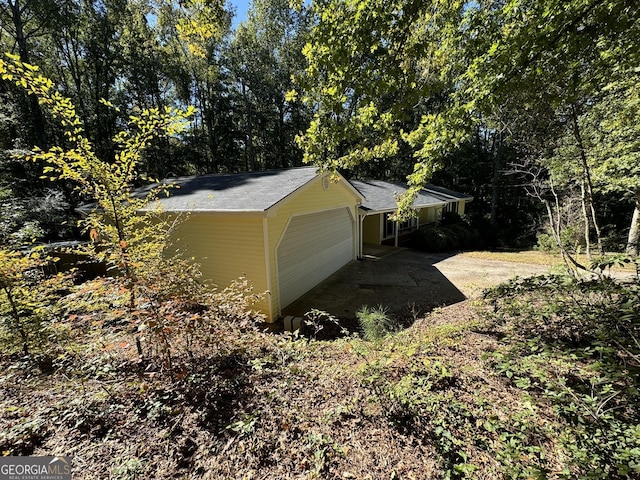 view of property exterior with a garage