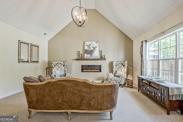 sitting room featuring light carpet, vaulted ceiling, and a notable chandelier