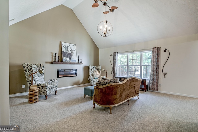 carpeted living room with high vaulted ceiling and a chandelier