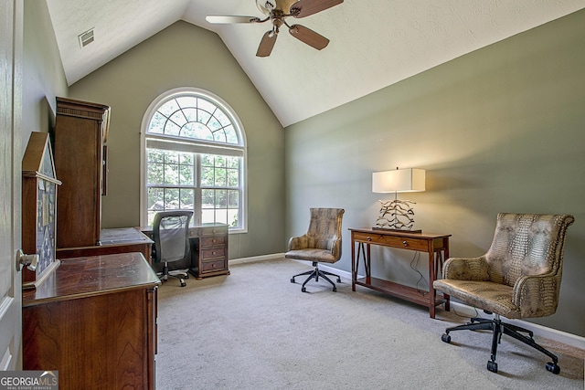 carpeted office featuring vaulted ceiling and ceiling fan