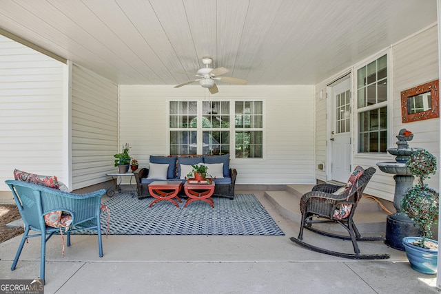 view of patio with ceiling fan and an outdoor living space