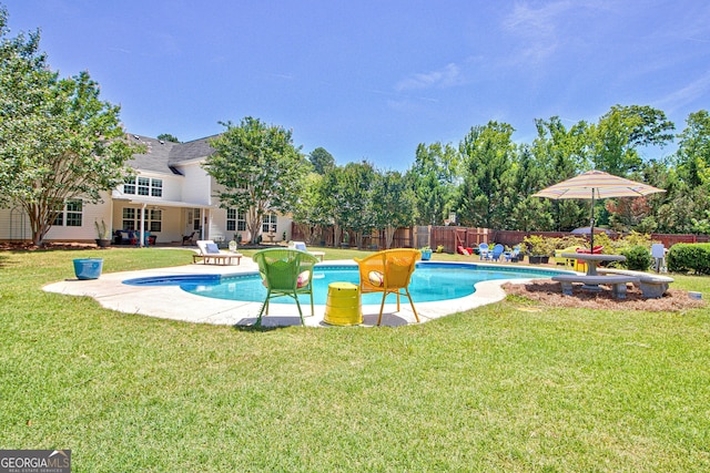 view of pool featuring a patio area and a yard