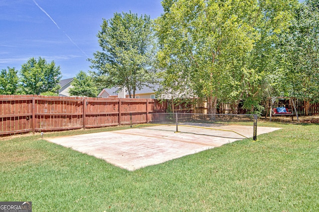 view of yard with tennis court