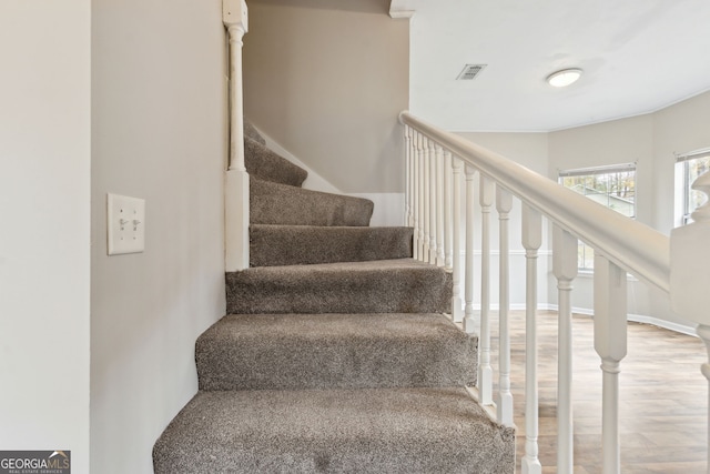 staircase featuring hardwood / wood-style flooring