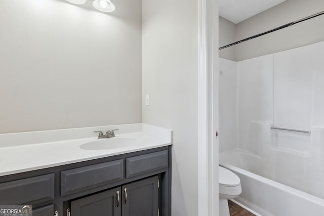 full bathroom featuring vanity, shower / bath combination, and toilet