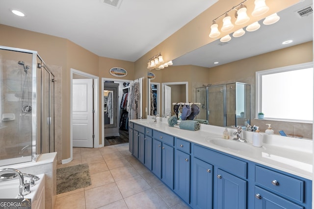 bathroom featuring vanity, tile patterned floors, and independent shower and bath