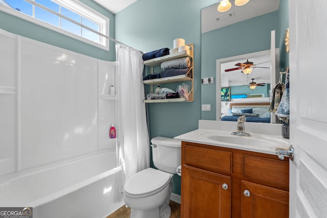 full bathroom with vanity, ceiling fan, toilet, shower / bath combo with shower curtain, and a fireplace