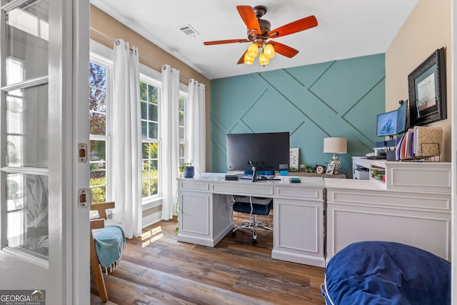 office space with dark hardwood / wood-style floors and ceiling fan