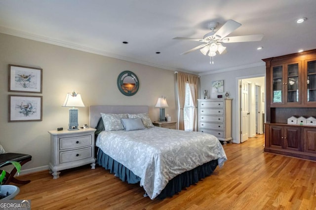 bedroom with ceiling fan, light wood-type flooring, and ornamental molding