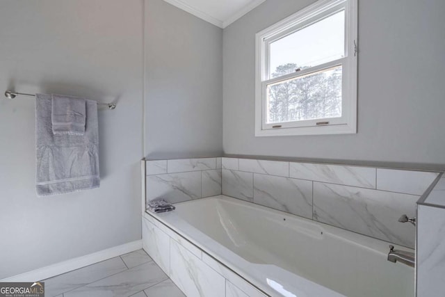 bathroom featuring a relaxing tiled tub and ornamental molding