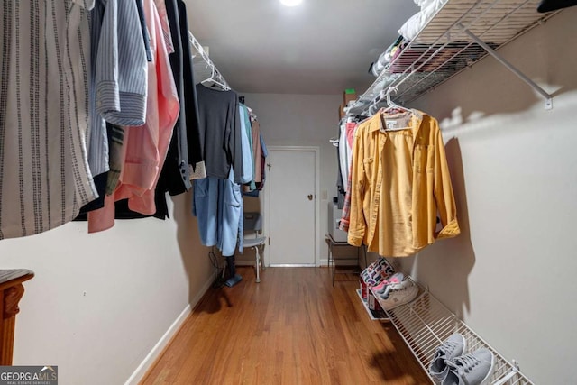 spacious closet featuring hardwood / wood-style flooring