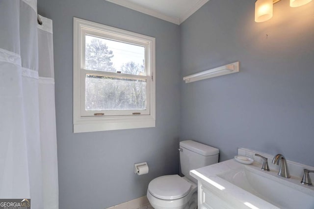 bathroom featuring tile patterned floors, vanity, toilet, and ornamental molding