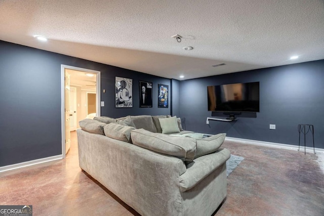 living room featuring concrete flooring and a textured ceiling