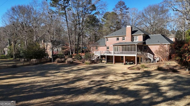 back of property featuring a sunroom