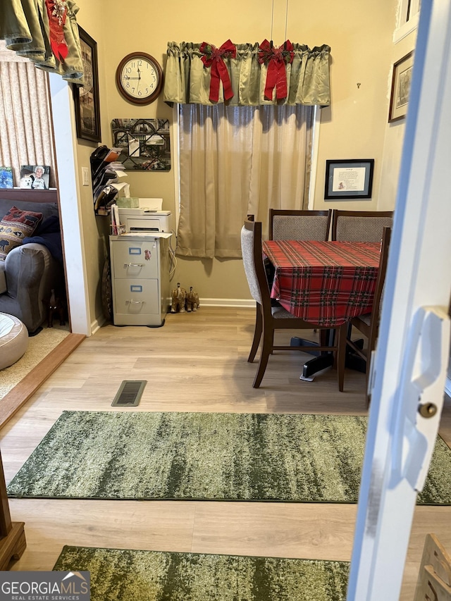 dining room featuring wood-type flooring