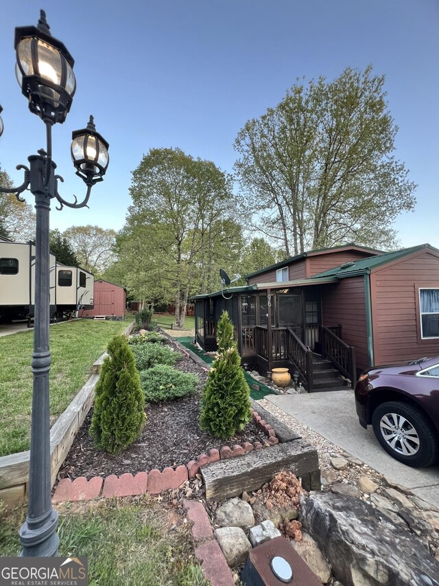 view of yard with a sunroom