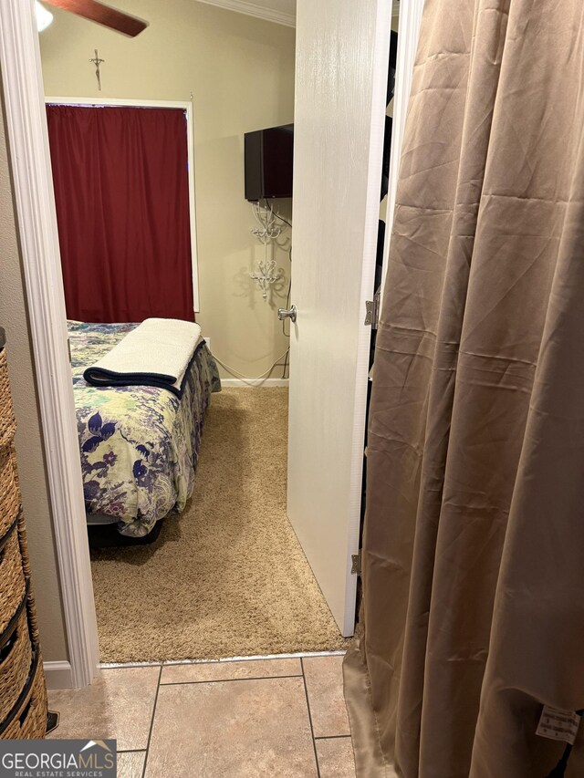 carpeted bedroom with crown molding