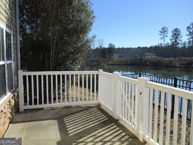 wooden deck featuring a water view